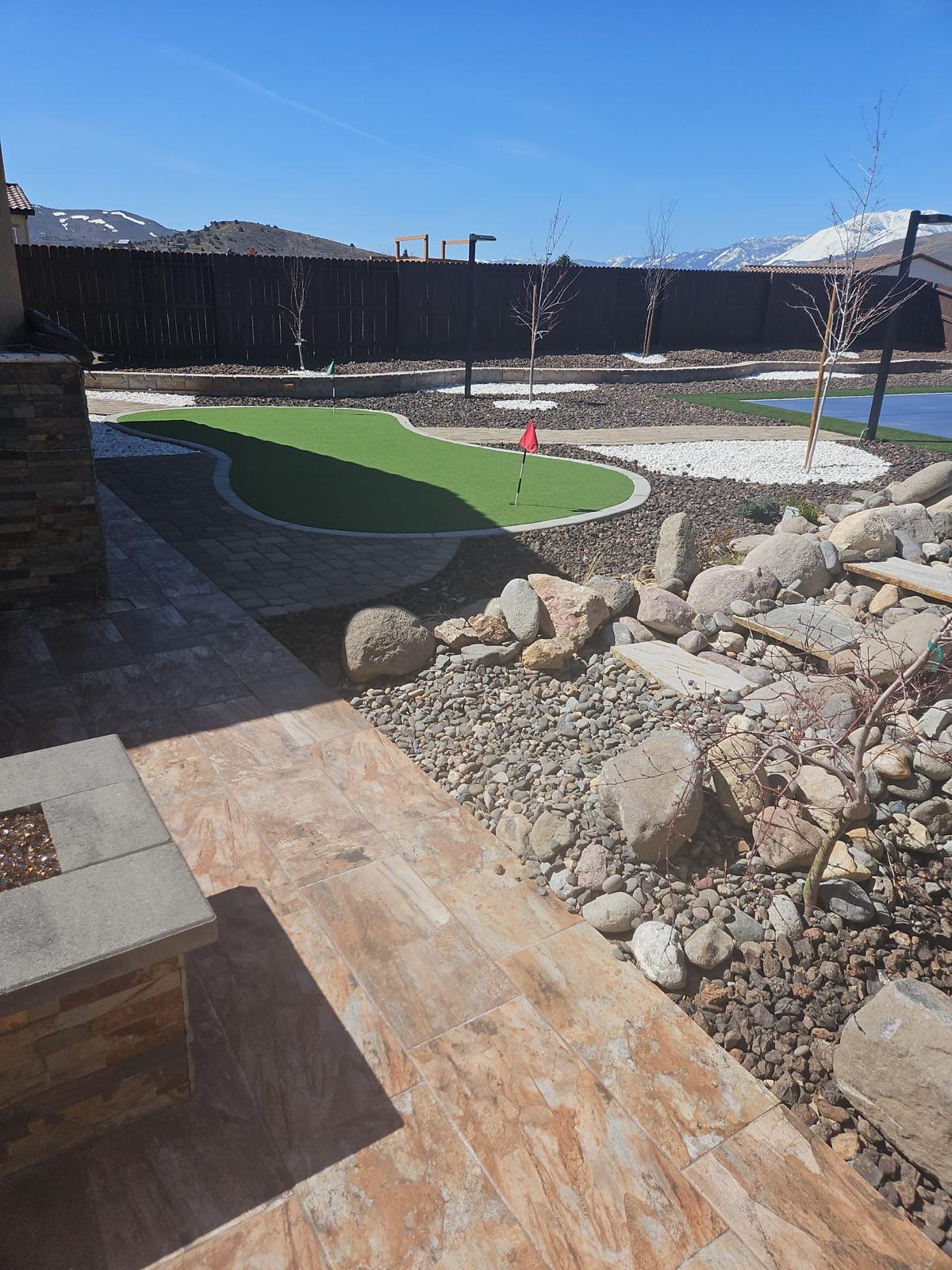 Backyard hardscape and putting green
