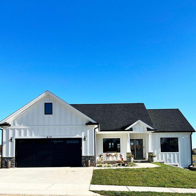 Completed white residential home by Cornerstone Construction